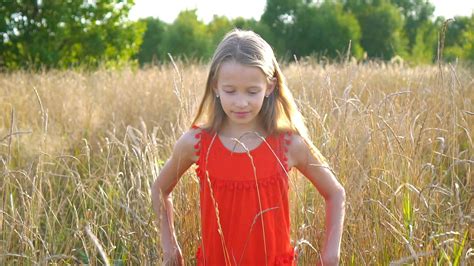 Beautiful Little Blonde Girl Has Happy Fun Cheerful Smiling Face Red