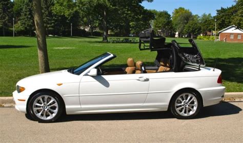 Finished in imola red over beige leather, the car factory literature is included in the sale. WBABW53494PL46691 - 2004 BMW 330ci CONVERTIBLE