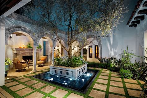 A spanish style home with a courtyard made for celebrating. 51 Captivating Courtyard Designs That Make Us Go Wow