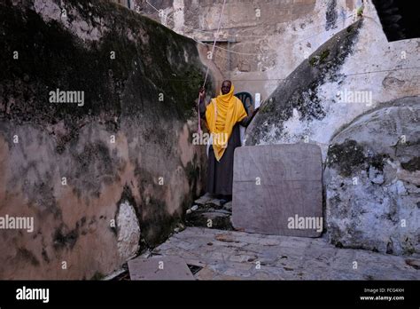 An Ethiopian Orthodox Christian Monk At The Open Courtyard Of Deir El