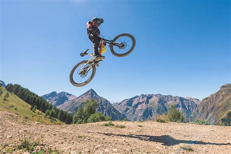 Man Jumping In Midair With Mountain Bike Del Colaborador De Stocksy Ibex Media Stocksy