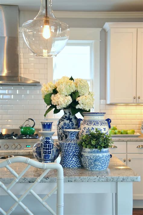 We know funerals and sympathy life events are difficult to express the right emotions. White Kitchen with Flowers on a Decorated Island | HGTV