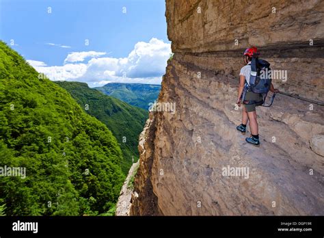Rock Climber Climbing On The Gerardo Sega Fixed Rope Route On Monte
