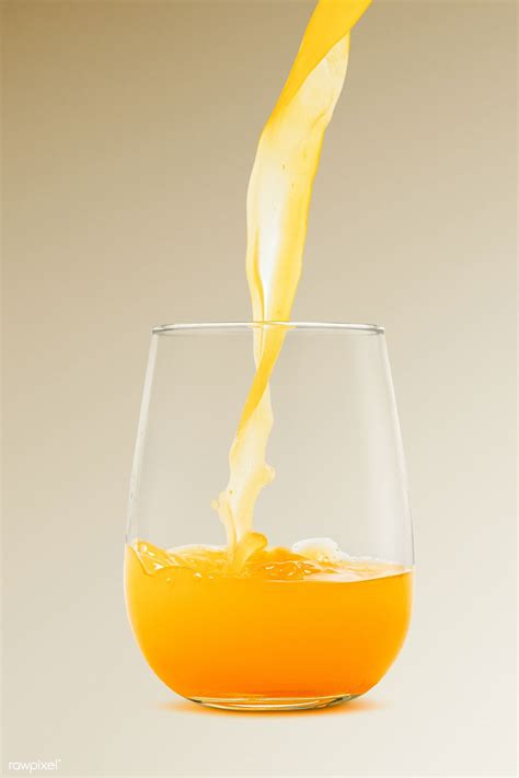 Download Premium Psd Of Pouring Fresh Organic Orange Juice To A Glass