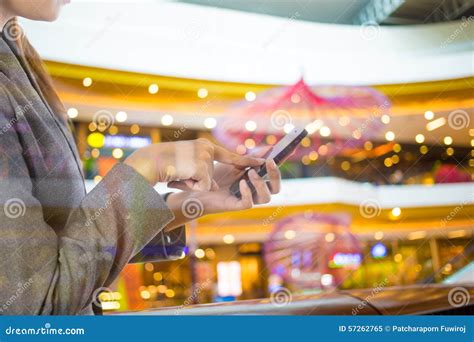 Businesswoman Using Smart Phone In Shopping Mall Stock Image Image