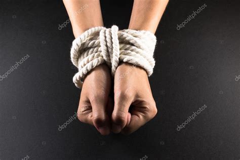Female Hands Bound In Bondage With Rope Stock Photo By ©johndwilliamsuk