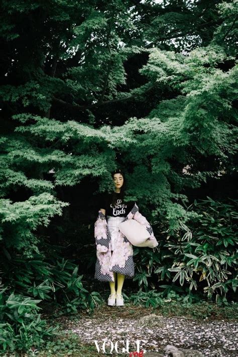 A Mannequin Is Standing In Front Of Some Trees And Bushes With The Words Joy Written On It