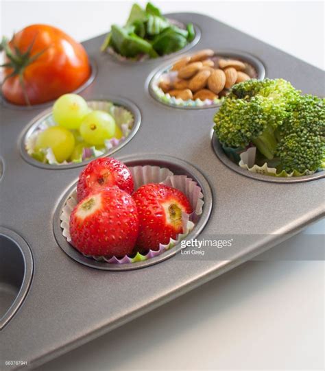 Heat oven to 350 degrees f. Cupcake pan filled with fruits and vegetables ...
