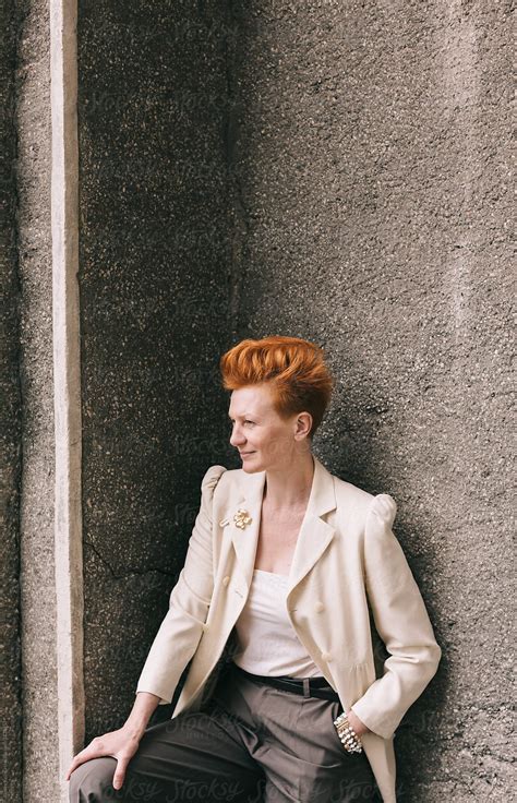 Attractive Woman Of Fifty Years With Red Hair Outdoors By Stocksy Contributor Alexey Kuzma