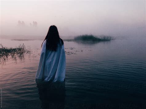 Woman In Lake At Sunrise By Stocksy Contributor Bor Cvetko Stocksy