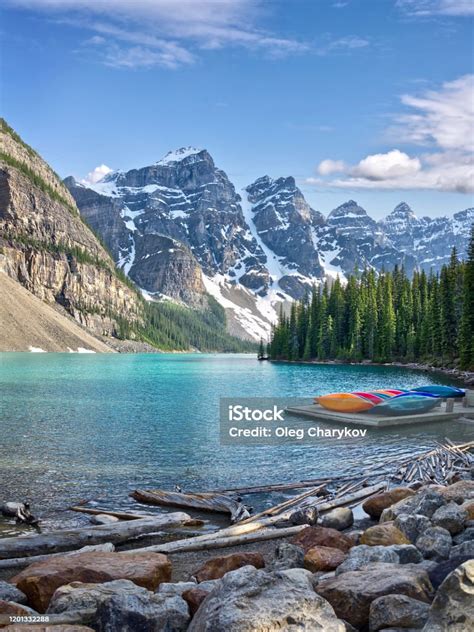 Turquoise Waters Of Beautiful Moraine Lake Snowcovered Rocky Mountains