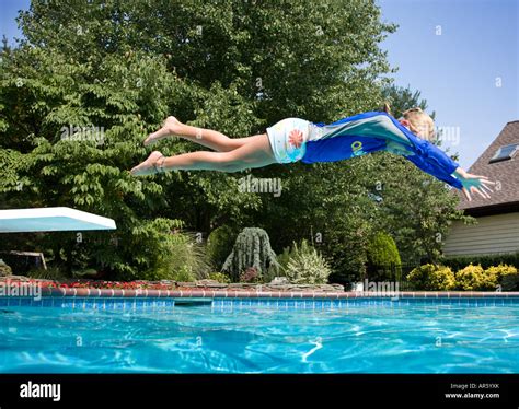 Young Girl Diving Into A Swimming Pool Stock Photo 15949674 Alamy