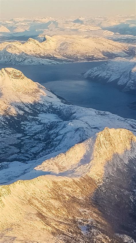 Aerial View At Sunset On Norwegian Mountains Fjords And Lake Troms