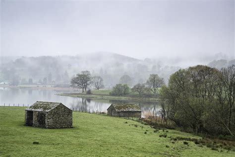 Beautiful Misty Morning Landscape Of Stone Huts Around Shores Of