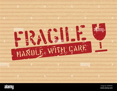 Grunge Fragile Sign Stamp On Cardboard Box For Logistics Or Cargo