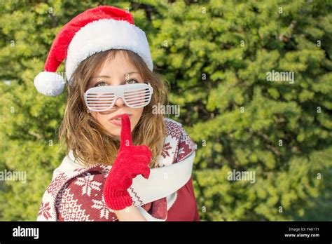 Beautiful Santa Claus Girl With Finger On Her Lips Shhh Stock Photo