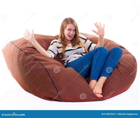 Girl Sitting On A Braun Beanbag Chair Stock Image Image Of Blond