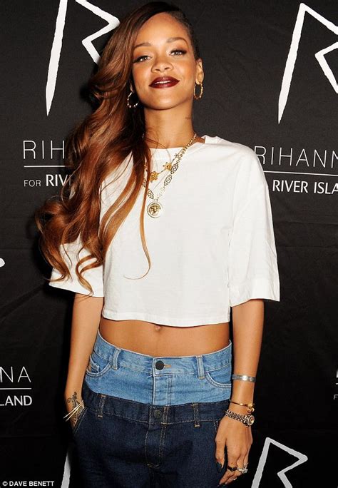 rihanna slips into double denim and shows off her midriff at river island launch after party