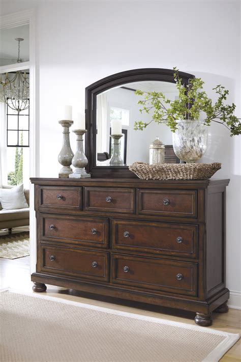 If your bedroom could use a little pop of color, the hudson accent chair is the perfect place to start. B697-31 Millennium by Ashley Porter Dresser Rustic Brown ...