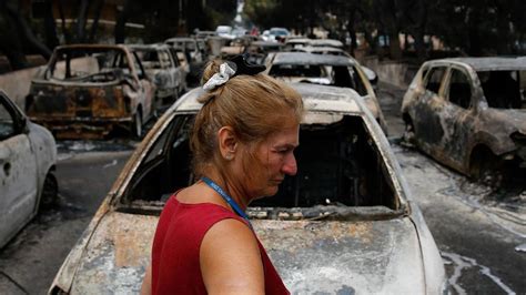 greece wildfires hugging bodies found near beach as death toll climbs to 74 national