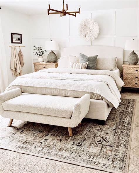 A Large Bed Sitting On Top Of A Rug In A Bedroom
