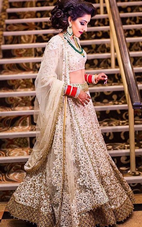 The second only to the bride/groom. Champagne/Gold Indian wedding reception lehenga | Indian ...