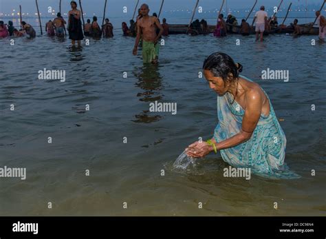 Woman Taking A Bath In The Sangam The Confluence Of The Rivers Ganges