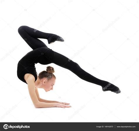 Little gymnast in a black suit doing gymnastic exercise. Young girl doing gymnastics on white background — Stock ...