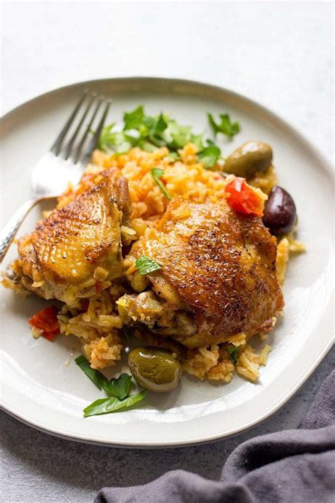 The juicy chicken and seasoned rice simmer with tomatoes, bell peppers, onions, peas and olives for a flavor explosion in. Spanish Chicken And Rice (Best Arroz Con Pollo) - Lavender ...