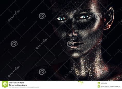 Woman In Black Paint With Silver Glitter Stock Image
