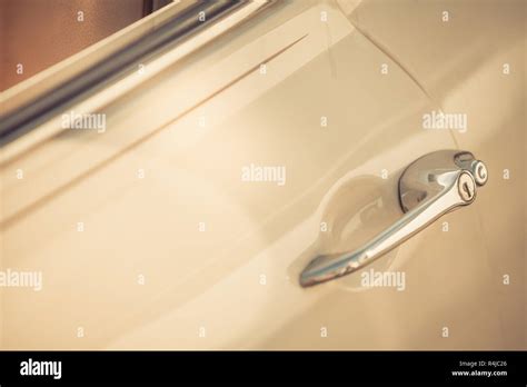 Vintage car door handle Stock Photo - Alamy