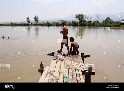 Young Intha Boys Swimming On The River Inle Lake Shan State Myanmar