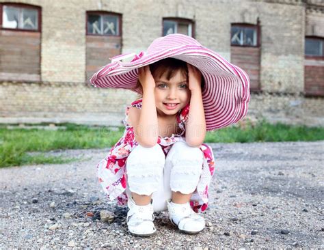 Cute Little Beautiful Girl With Pink Umbrella And Handbag In Park Stock