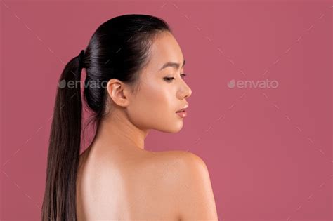 Sexy Naked Chinese Woman Posing On Purple Studio Background Stock Photo
