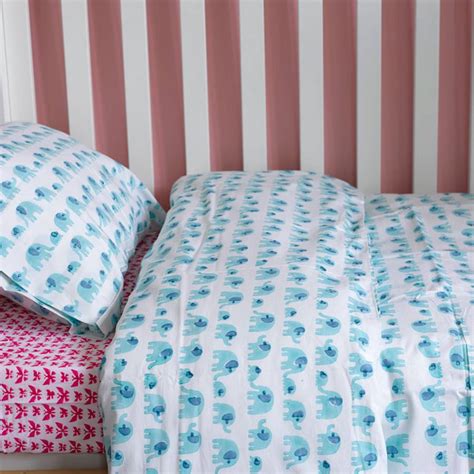 Get quality cot bed bedding at tesco. turquoise elephant toddler cot bed duvet set by lulu and ...