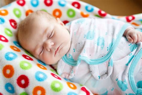 Cute Little Newborn Baby Girl Sleeping Wrapped In Blanket Stock Photo