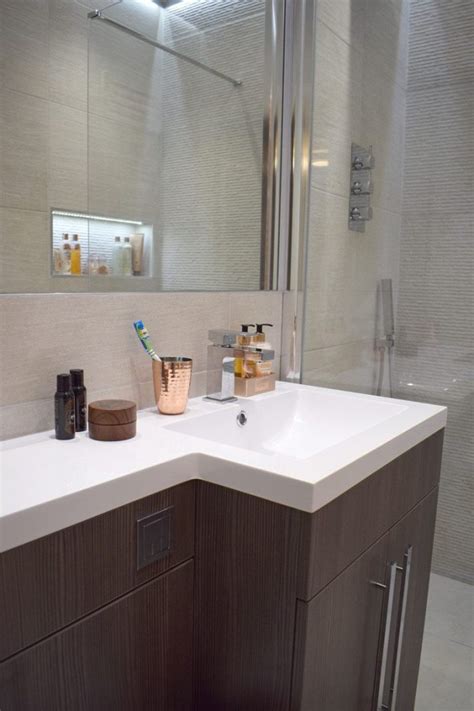 Shelves suspended from long double c hooks and eye bolts lend an industrial, yet elegant storage area to a small bathroom. A Small Ensuite Makeover