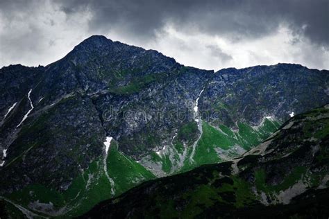 Dark Sky Over A Rocky Peak In The Mountains Stock Image Image Of