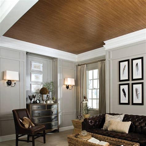 Drop ceilings are an excellent way to paint or stain lightweight wood or plastic moldings and glue them onto the tile. Unappealing Ceiling? Cover it up with wood-look planks