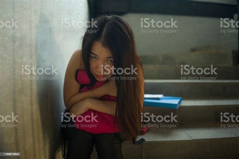 Dramatic Portrait Of Asian Female College Student Bullied Young