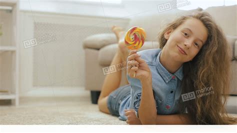 Beautiful Fair Haired Teen Girl With Candy Playful Cute Girl With Big Sweet Stock Video Footage