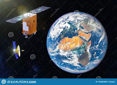Two Space Satellite Orbiting The Earth Elements Of This Image