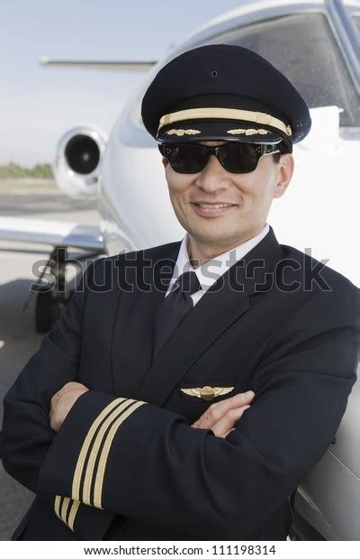 Happy Pilot Arms Folded Leaning On Stock Photo Edit Now 111198314