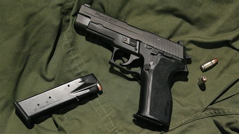 1024x600 Resolution Black And Gray Semi Automatic Pistol With
