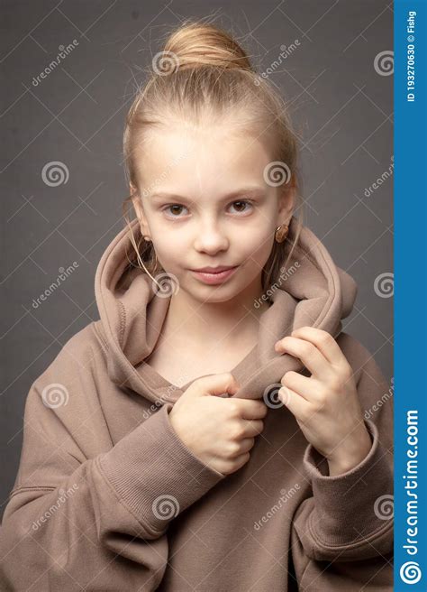 Hild Girl With Long Hair Gathered In A Bun Stock Photo Image Of Girl