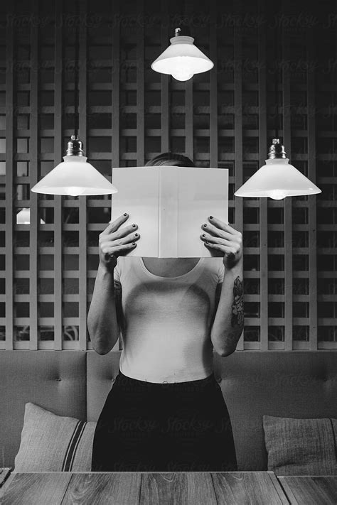 Woman Hiding Her Face With A Book By Thais Varela Book Hide