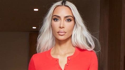 kim kardashian reveals shrinking waist in skintight red leggings and matching top in new photos