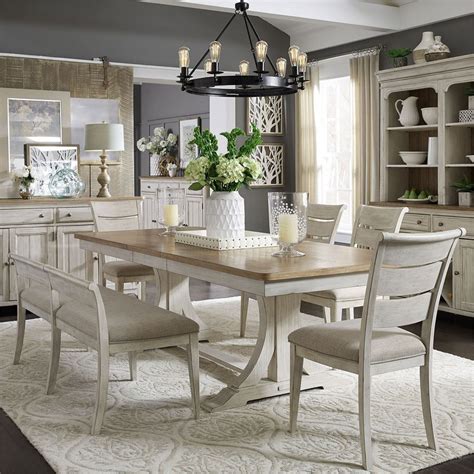 The rectangle dining table features a trestle style base, perfecting the rustic, farmhouse style. Farmhouse Reimagined Rectangular Dining Set w/ Upholstered ...