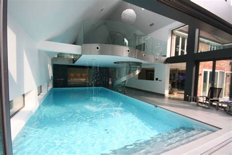Indoor Pool With Waterfall Features Sauna And Stainless Steel Spa