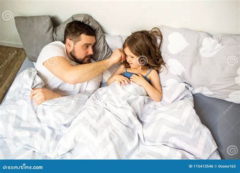 Dad And Babe Have Fun At Home On The Bed Father S Day Stock Photo Image Of Cheerful